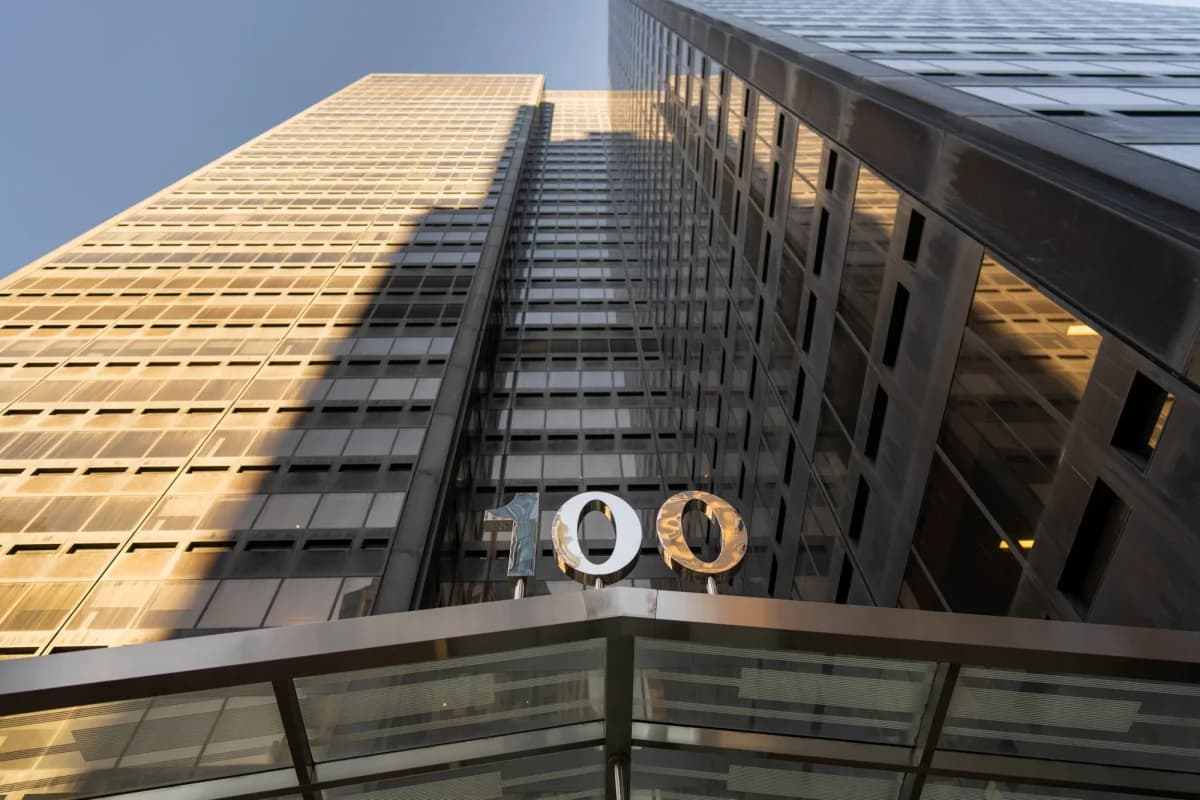 Looking up at the facade of the 100 Summer Street office tower in Boston