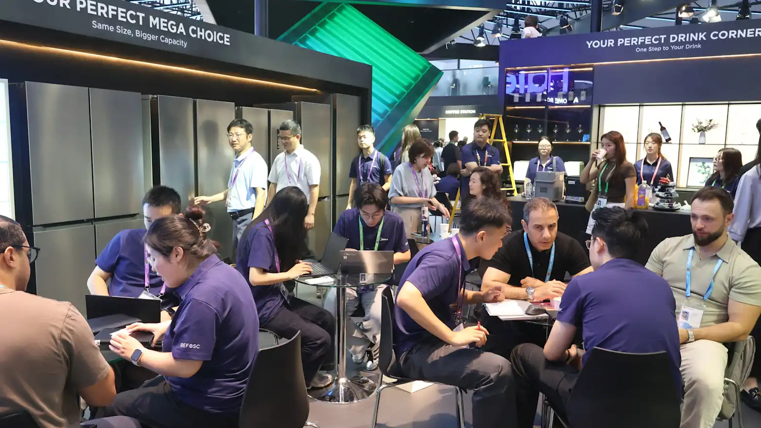 Exhibitors and visitors gather around booths displaying smart appliances at the Canton Fair