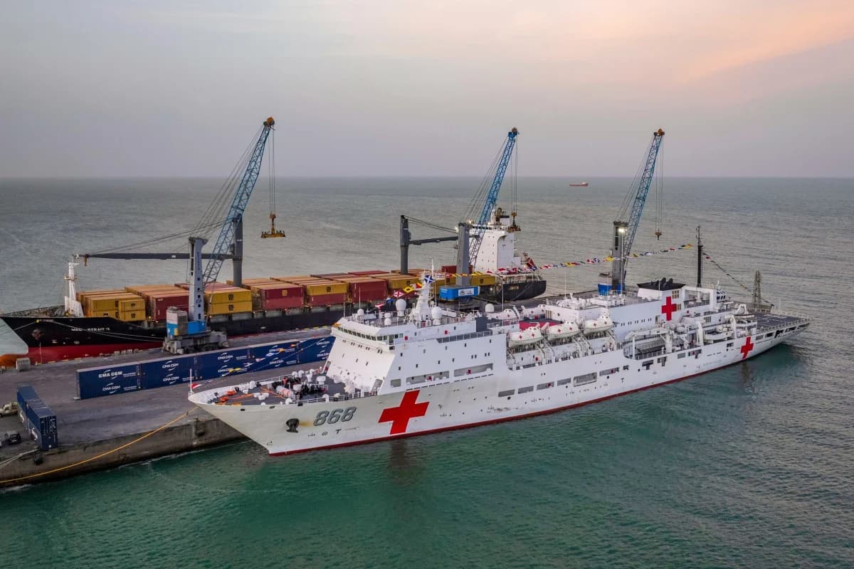 China's naval hospital ship Auspicious Ark docked at a port, marked with red cross emblems